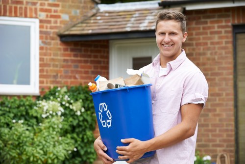 Waste removal truck servicing a commercial building